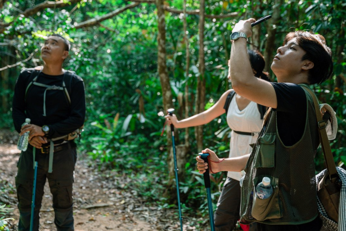 Hikers trekking through Phu Quoc National Park’s forest trail